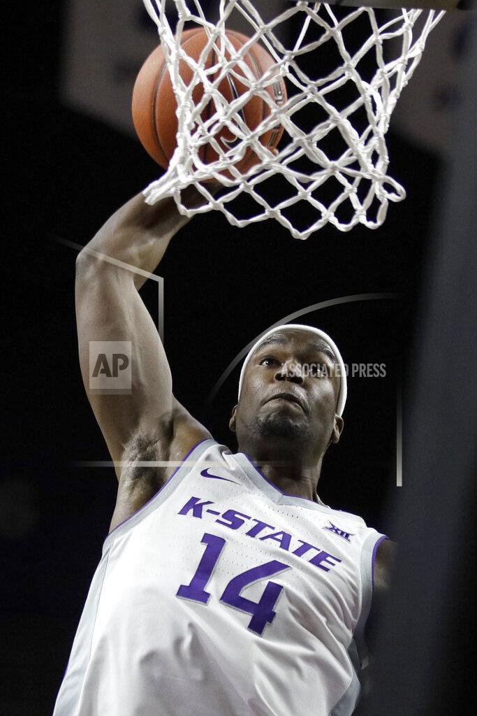 Orlin Wagner Kansas State forward Makol Mawien dunks during the second half of the team's NCAA college basketball game against Monmouth in Manhattan, Kan., Wednesday, Nov. 13, 2019. (AP Photo/Orlin Wagner)