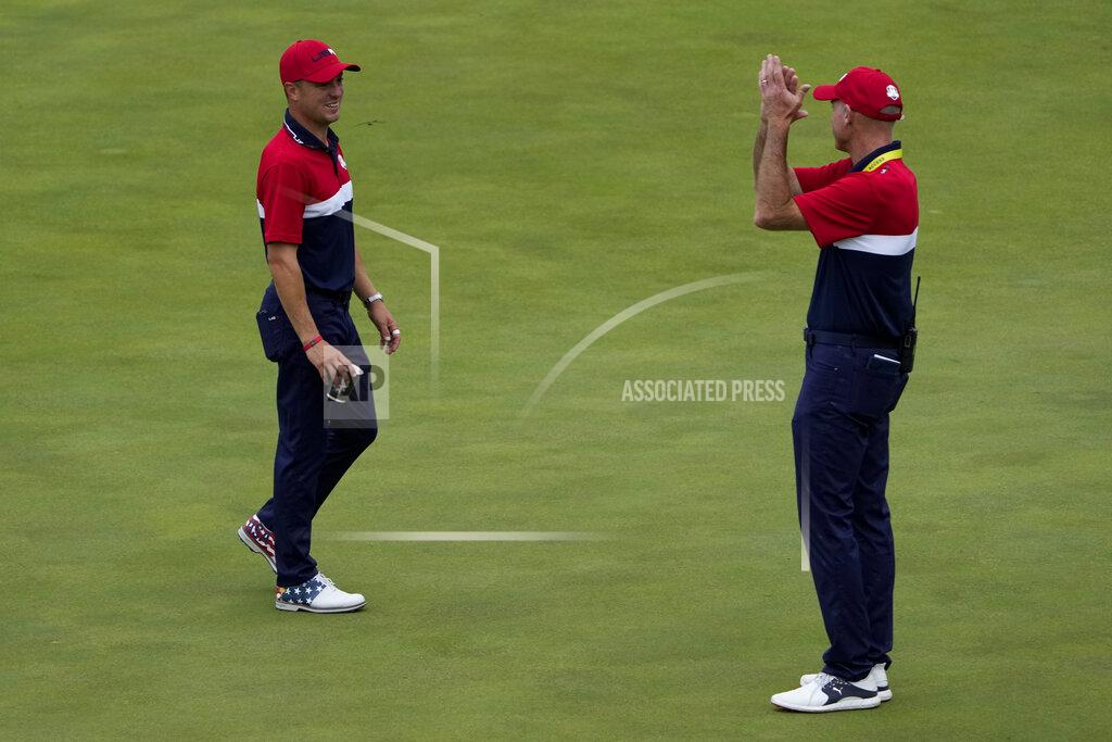 Jeff Roberson Team USA assistant captain Jim Furyk applauds Justin Thomas after the Ryder Cup matches at the Whistling Straits Golf Course Sunday, Sept. 26, 2021, in Sheboygan, Wis. (AP Photo/Jeff Roberson)