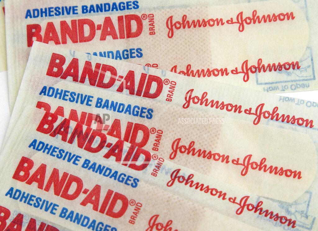 FILE - This Sept. 13, 2016, file photo, shows Johnson & Johnson Band-Aid brand bandages in Surfside, Fla. Higher prescription drug sales and lower costs for litigation drove up Johnson & Johnson's fourth-quarter profit by 32%. The world's biggest maker of health care products on Wednesday, July 15, 2020, reported net income rose nearly $1 billion, to $4.01 billion, or $1.50 per share. (AP Photo/Wilfredo Lee, File)