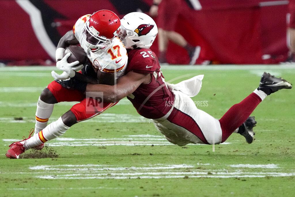 Rick Scuteri Kansas City Chiefs wide receiver Mecole Hardman (17) is tackled by Arizona Cardinals linebacker Zaven Collins (25) during the first half of an NFL football game, Friday, Aug. 20, 2021, in Glendale, Ariz. (AP Photo/Rick Scuteri)