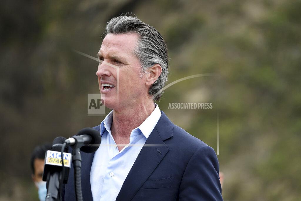 Nic Coury FILE - In this April 23, 2021, file photo, California Gov. Gavin Newsom speaks during a press conference in Big Sur, Calif. California on Saturday is increasing early release credits for tens of thousands of inmates including violent and repeat felons as it further trims the population of what once was the nation's largest state correctional system. Officials announced in mid-April that they will close a second prison as a result of the dwindling population, fulfilling a promise by Newsom. (AP Photo/Nic Coury, File)