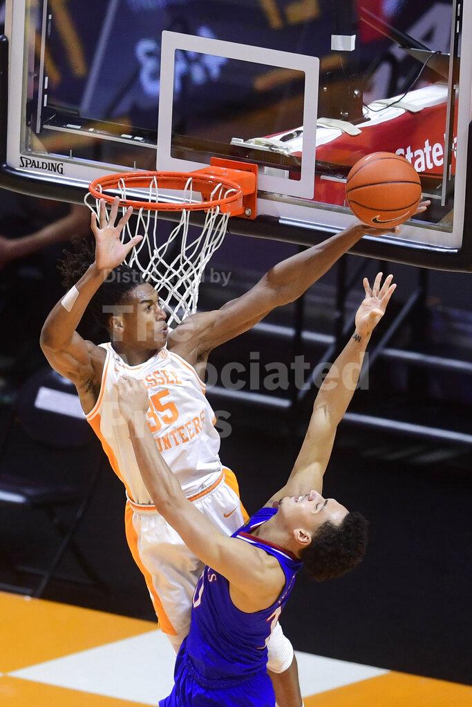 Tennessee guard/forward Yves Pons (35) blocks a shot attempt by Kansas forward Jalen Wilson (10) during an NCAA college basketball game in Knoxville, Tenn., Saturday, Jan. 30, 2021. (Caitie McMekin/Knoxville News Sentinel via AP, Pool)