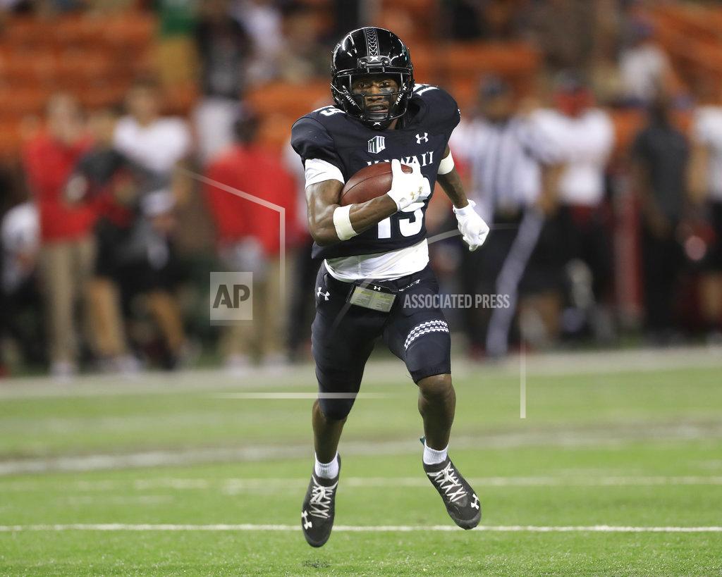 Marco Garcia Hawaii wide receiver JoJo Ward (19) runs the ball for a touchdown to tie the game against UNLV during the fourth quarter of an NCAA college football game, Saturday, Nov. 17, 2018, in Honolulu. Hawaii would go on to defeat UNLV 35-28. (AP Photo/Marco Garcia)