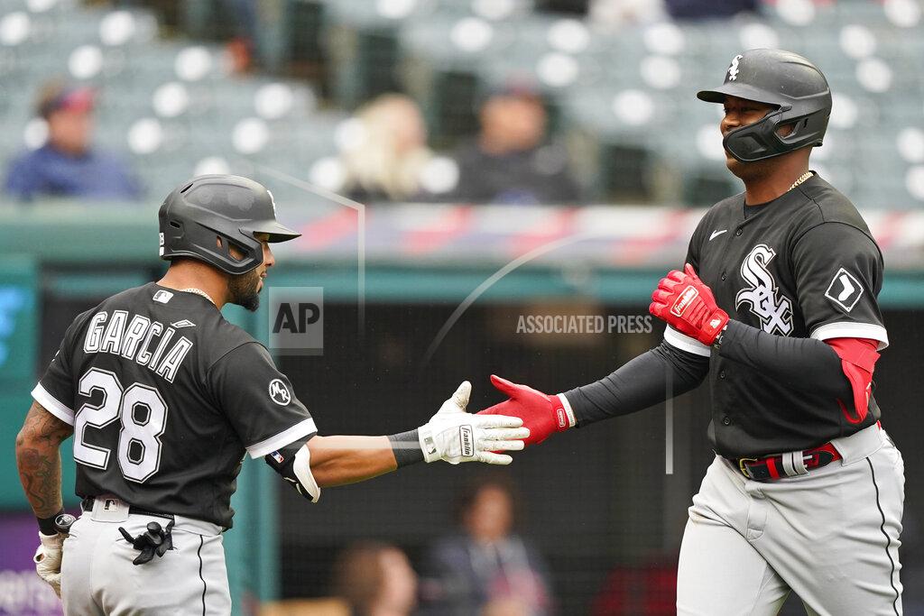 Tony Dejak Chicago White Sox's Eloy Jimenez, right, celebrates with Leury Garcia after Jimenez hit a solo home run in the second inning in the first baseball game of a doubleheader against the Cleveland Indians, Thursday, Sept. 23, 2021, in Cleveland. (AP Photo/Tony Dejak)