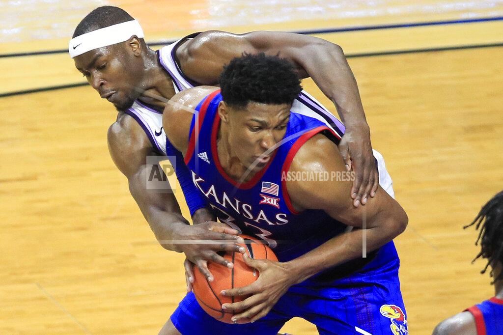 Orlin Wagner Kansas forward David McCormack (33) is fouled by Kansas State forward Makol Mawien, left, during the second half of an NCAA college basketball game in Manhattan, Kan., Saturday, Feb. 29, 2020. Kansas defeated Kansas State 62-58. (AP Photo/Orlin Wagner)