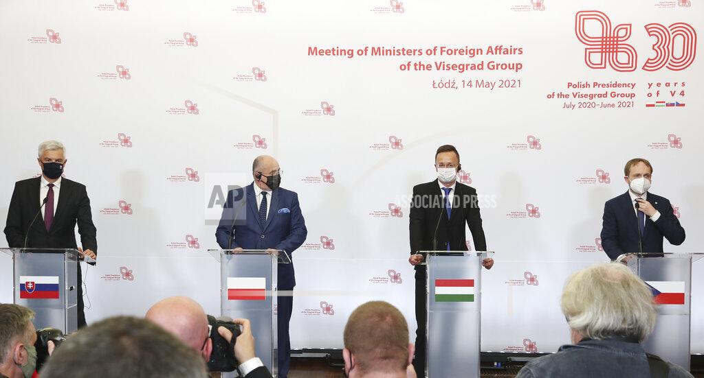 Czarek Sokolowski Slovak Foreign Minister Ivan Korcok, left, Polish Foreign Minister Zbigniew Rau, Hungarian Foreign Minister Peter Szijjarto and Czech Republic Foreign Minister Tomas Petricek, right, attend a press conference after the foreign ministers of the Visegrad Group ,V4, in Lodz, Poland, Friday, May 14, 2021.(AP Photo/Czarek Sokolowski)
