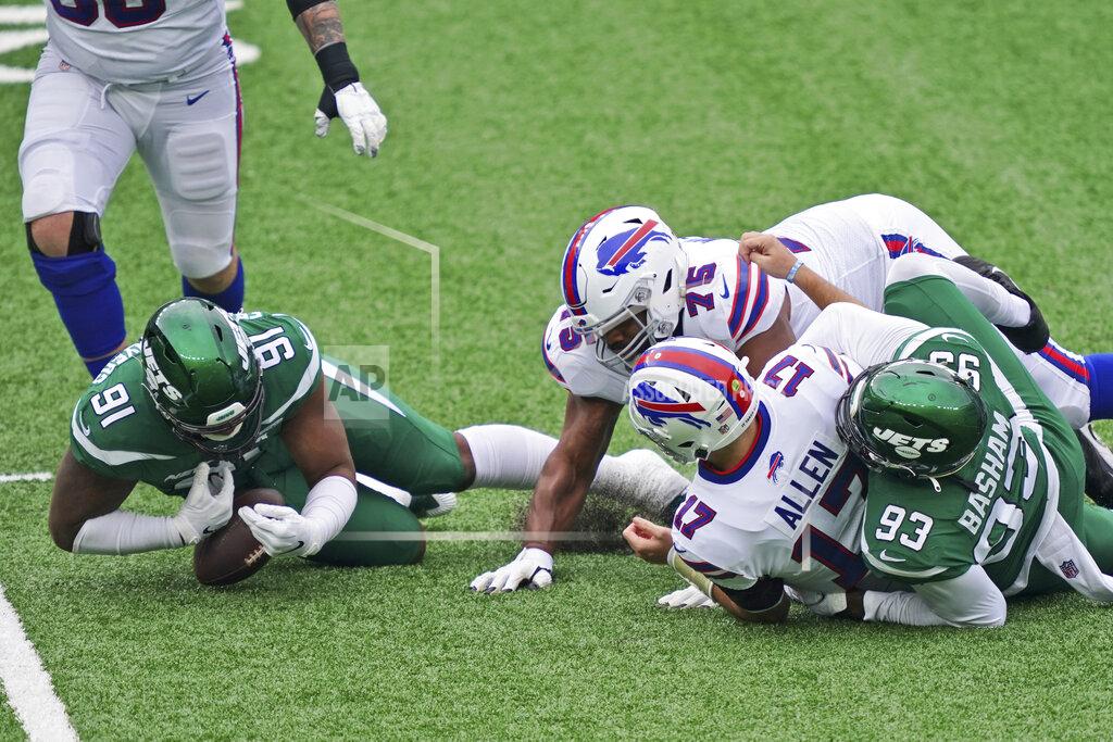 John Minchillo New York Jets' John Franklin-Myers (91), left, recovers the ball fumbled by Buffalo Bills quarterback Josh Allen (17) during the first half of an NFL football game, Sunday, Oct. 25, 2020, in East Rutherford, N.J. (AP Photo/John Minchillo)