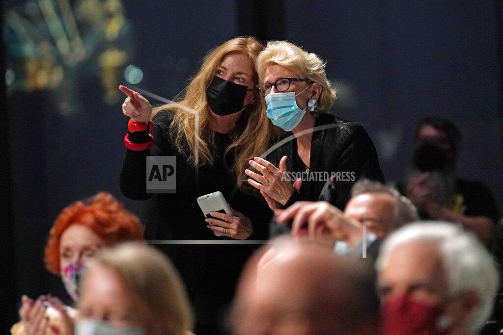 Kathy Willens Members of the audience chat at the conclusion of a live performance by the New York Philharmonic after the orchestra performed together before a crowd of 150 socially-distanced spectators for the first time since March 10, 2020, at The Shed in Hudson Yards, Wednesday, April 14, 2021, in New York. (AP Photo/Kathy Willens)