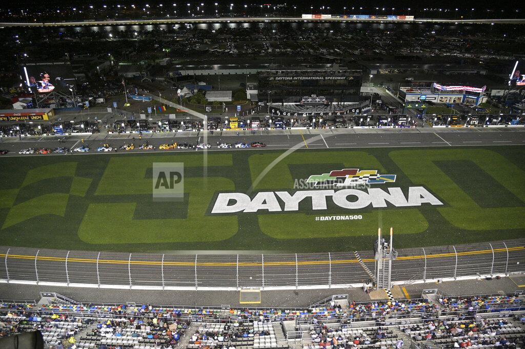 Phelan M. Ebenhack Drivers stop on pit road as rain begins falling before the first of two Daytona 500 qualifying auto races at Daytona International Speedway, Thursday, Feb. 13, 2020, in Daytona Beach, Fla. (AP Photo/Phelan M. Ebenhack)