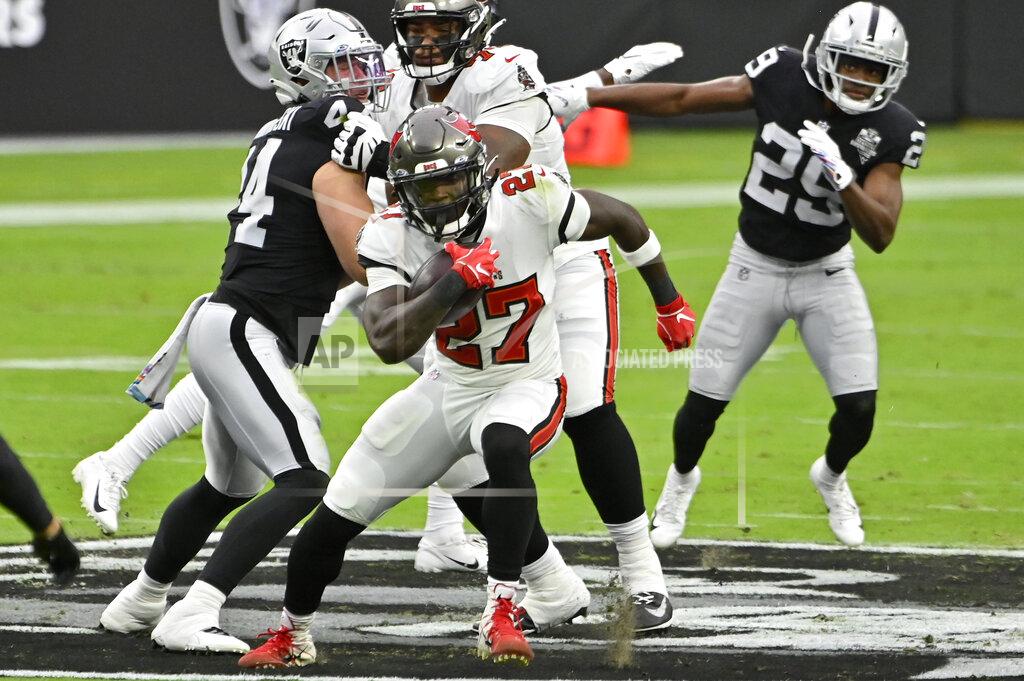 David Becker Tampa Bay Buccaneers running back Ronald Jones (27) runs against the Las Vegas Raiders during the first half of an NFL football game, Sunday, Oct. 25, 2020, in Las Vegas. (AP Photo/David Becker)