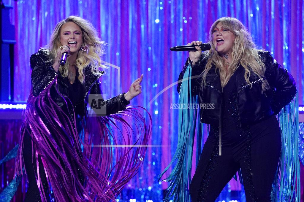 Mark Humphrey Miranda Lambert, left, and Elle King perform at the 56th annual Academy of Country Music Awards on Saturday, April 17, 2021, at the Grand Ole Opry in Nashville, Tenn. The awards show airs on April 18 with both live and prerecorded segments. (AP Photo/Mark Humphrey)