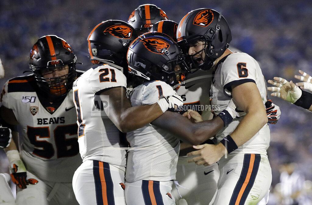 Marcio Jose Sanchez Oregon State wide receiver Tyjon Lindsey (1) celebrates his touchdown catch with teammates during the second half of an NCAA college football game against UCLA on Saturday, Oct. 5, 2019, in Pasadena, Calif. (AP Photo/Marcio Jose Sanchez)