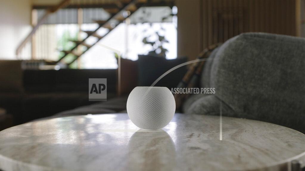 This image provided by Apple shows the new HomePod Mini that Apple unveiled Tuesday, Oct. 13, 2020. The new HomePod Mini will cost almost $100. It will integrate Apple's own music service, of course, with Pandora and Amazon's music service in “coming months.” (Apple via AP)