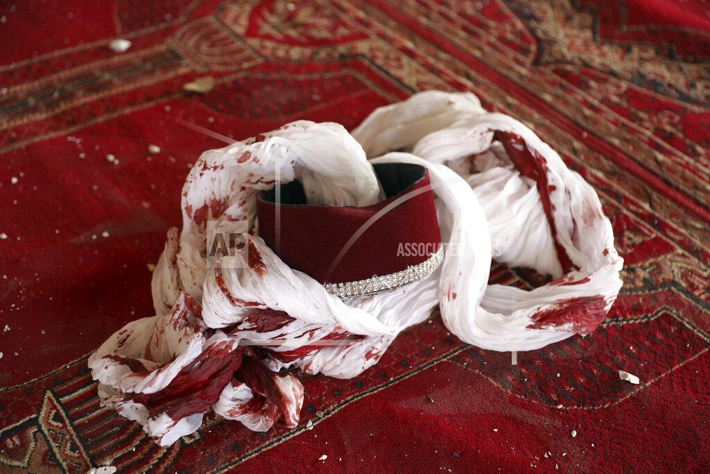 Rahmat Gul A blood-stained turban and cap are seen inside a mosque after a bomb explosion in Shakar Dara district of Kabul, Afghanistan, Friday, May 14, 2021. A bomb ripped through a mosque in northern Kabul during Friday prayers killing 12 worshippers, Afghan police said. (AP Photo/Rahmat Gul)