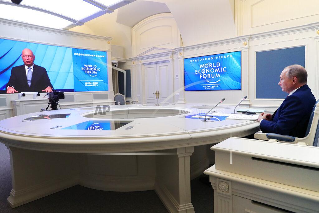 Mikhail Klimentyev Russian President Vladimir Putin speaks to participants of the the World Economic Forum via a video link in Moscow, Russia, Wednesday, Jan. 27, 2021. Putin warned of rising global tensions and growing risks of new conflicts and called for broader international cooperation to tackle new challenges. (Mikhail Klimentyev, Sputnik, Kremlin Pool Photo via AP)