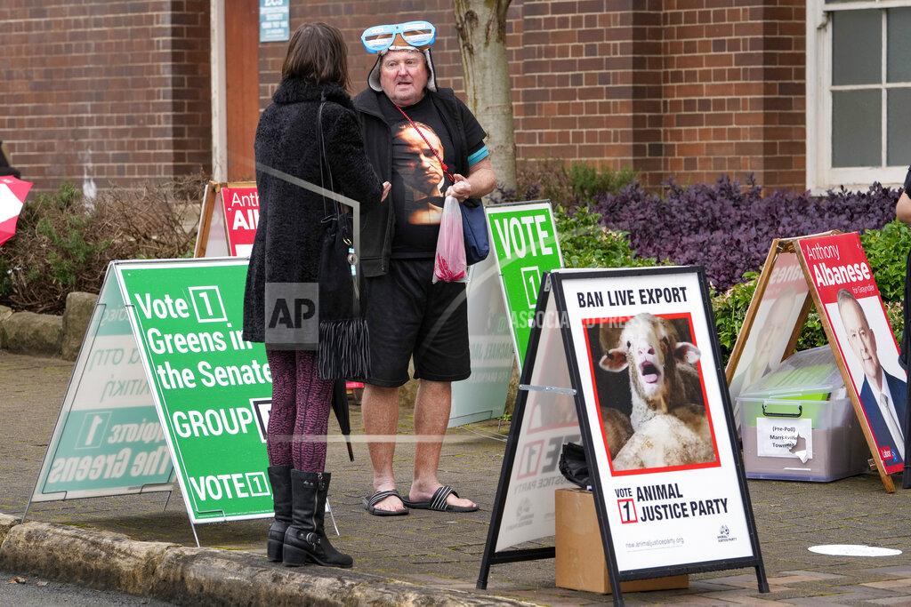 Mark Baker Voters wait outside a pre-polling booth in Sydney, Australia, Friday, May 20, 2022. Australians will go to the polls Saturday following a six-week election campaign that has focused on pandemic-fueled inflation, climate change and fears of a Chinese military outpost being established less than 1,200 miles off Australia's shore. (AP Photo/Mark Baker)