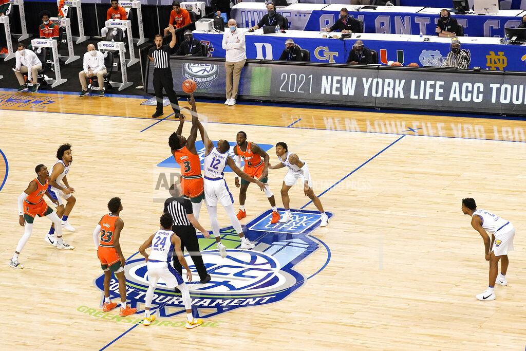 Gerry Broome Miami center Nysier Brooks (3) and Pittsburgh forward Abdoul Karim Coulibaly (12) battle for the ball during the tipoff of an NCAA college basketball game in the first round of the Atlantic Coast Conference tournament in Greensboro, N.C., Tuesday, March 9, 2021. (AP Photo/Gerry Broome)