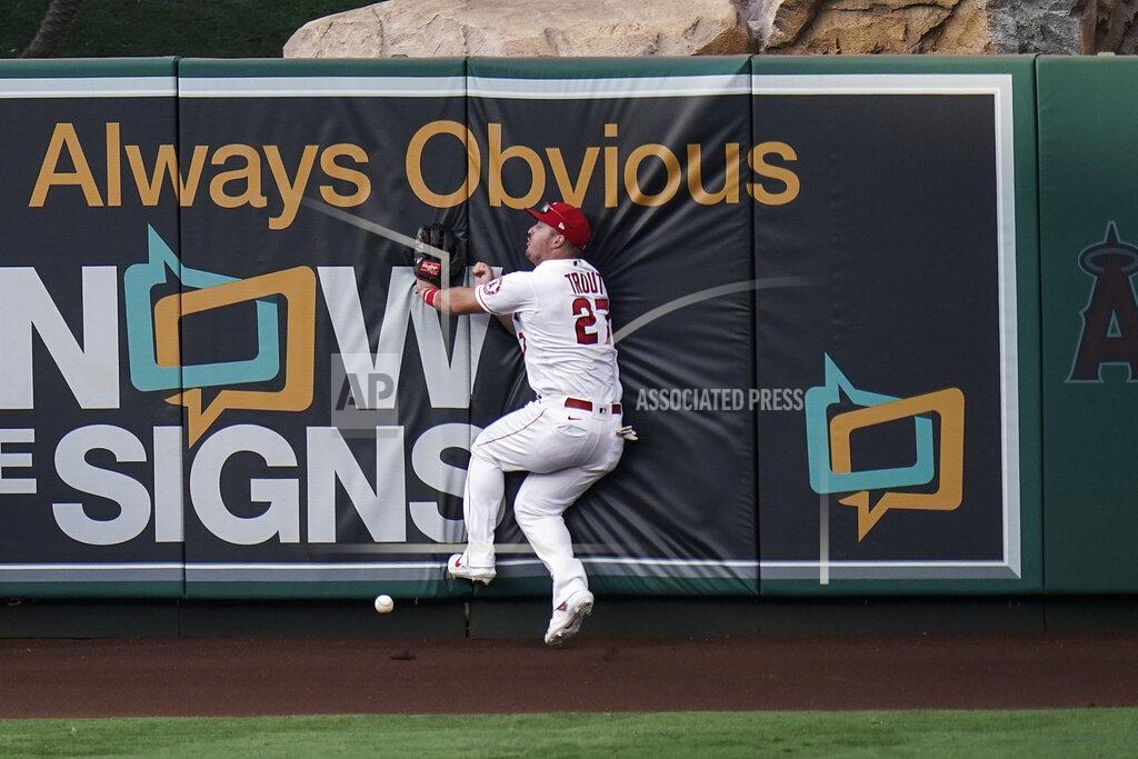 Jae C. Hong Los Angeles Angels' Mike Trout collides with the wall while trying to catch a triple hit by Houston Astros' George Springer during the fifth inning of the first baseball game of a doubleheader, Saturday, Sept. 5, 2020, in Anaheim, Calif. (AP Photo/Jae C. Hong)