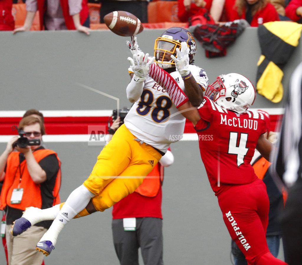 Chris Seward North Carolina State's Nick McCloud (4) blocks a pass intended for East Carolina's Trevon Brown (88) during the first half of NCAA college football game in Raleigh, N.C., Saturday, Dec. 1, 2018. McCloud intercepted the pass as it came back down after the block. (AP Photo/Chris Seward)