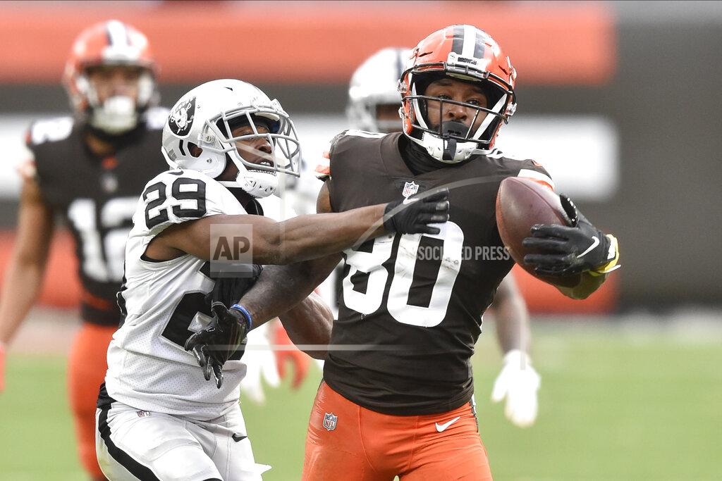 David Richard FILE - In this Sunday, Nov. 1, 2020 file photo, Cleveland Browns wide receiver Jarvis Landry (80) makes a one-handed catch beside Las Vegas Raiders free safety Lamarcus Joyner (29) during an NFL football game in Cleveland. Every day on the practice field, Jarvis Landry looks around and expects to see Odell Beckham Jr. dancing during warmups or running pass routes alongside him. But his best friend and teammate isn't around _ and won't be until next year. (AP Photo/David Richard, File)