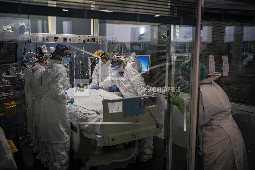 Felipe Dana A COVID-19 patient receives treatment in the ICU of the Hospital del Mar, in Barcelona, Spain, Tuesday, Jan. 19, 2021. The unrelenting increase in COVID-19 infections in Spain following the holiday season is again straining hospitals, threatening the mental health of doctors and nurses who have been at the forefront of the pandemic for nearly a year. (AP Photo/Felipe Dana)