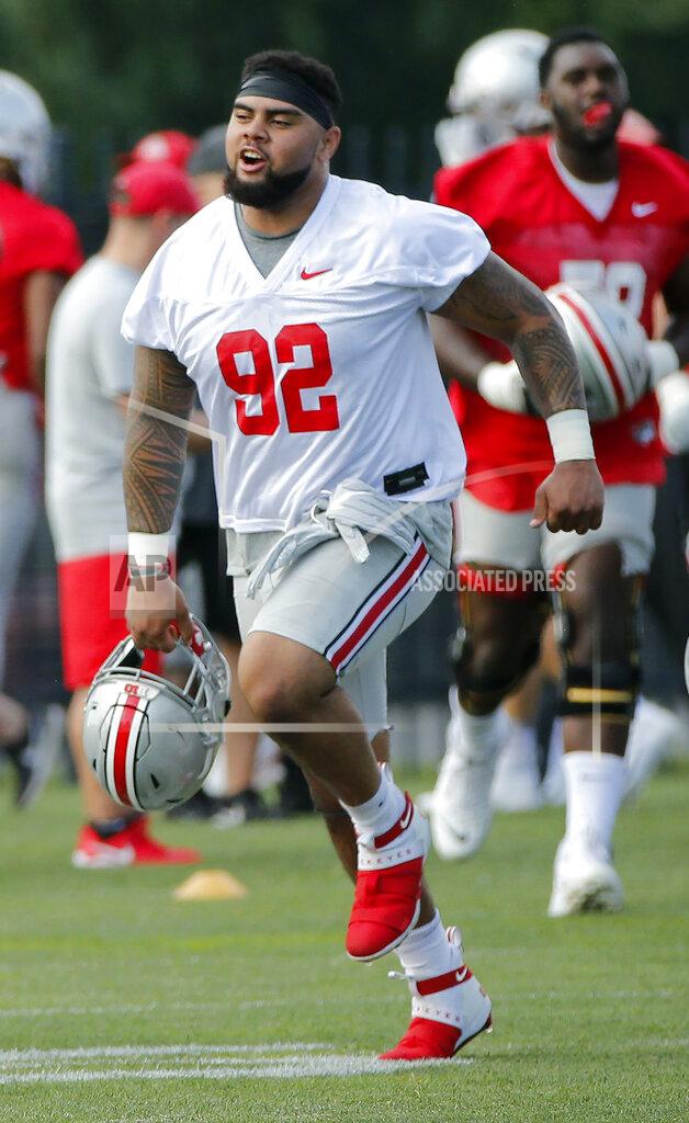Adam Cairns Ohio State Buckeyes defensive tackle defensive tackle Haskell Garrett runs across the field during football practice at the Woody Hayes Athletic Center in Columbus on Friday, Aug. 2, 2019. Garrett is expected to be released from the hospital after being shot in the face over the weekend, coach Ryan Day said. Day said in a statement that Garrett, who was hit by a bullet that passed through both of his cheeks, was expected to be released Monday, Aug. 31, 2020. (Adam Cairns/The Columbus Dispatch via AP)