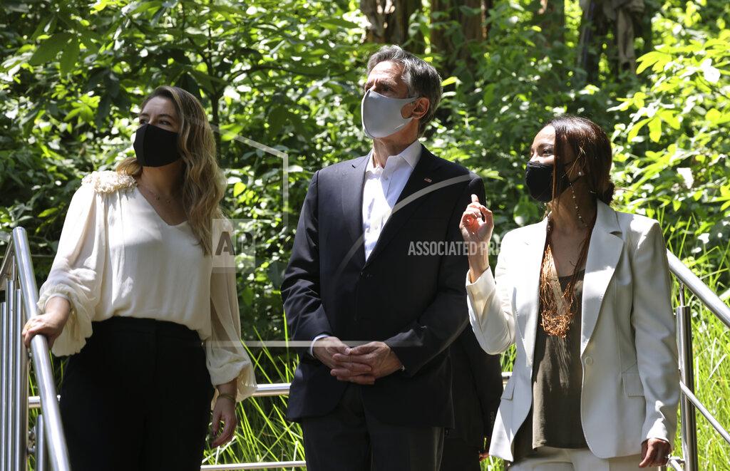 Evelyn Hockstein U.S. Secretary of State Antony Blinken listens to Costa Rica's first lady Claudia Dobles and Minister of Environment Andrea Meza, right, during a visit to see Rutas Naturbanas and of the launch of National Land Use, Land Cover, and Ecosystems Monitoring System (SIMOCUTE), Wednesday, June 2, 2021, in San Jose, Costa Rica. (Evelyn Hockstein/Pool via AP)