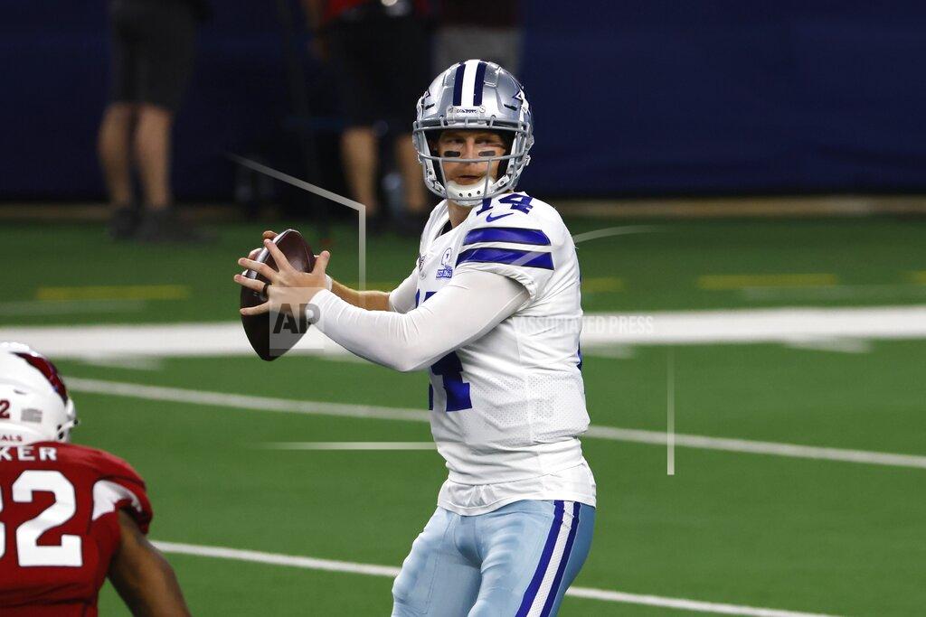 Ron Jenkins Arizona Cardinals safety Budda Baker, left, pressures as Dallas Cowboys quarterback Andy Dalton (14) prepares to throw a pass in the first half of an NFL football game in Arlington, Texas, Monday, Oct. 19, 2020. (AP Photo/Ron Jenkins)