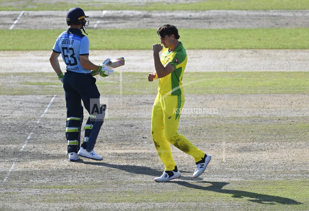 Shaun Botterill Australia's Pat Cummins, right, celebrates the dismissal of England's Jos Buttler, left, during the second ODI cricket match between England and Australia, at Old Trafford in Manchester, England, Sunday, Sept. 13, 2020. (Shaun Botterill/Pool via AP)