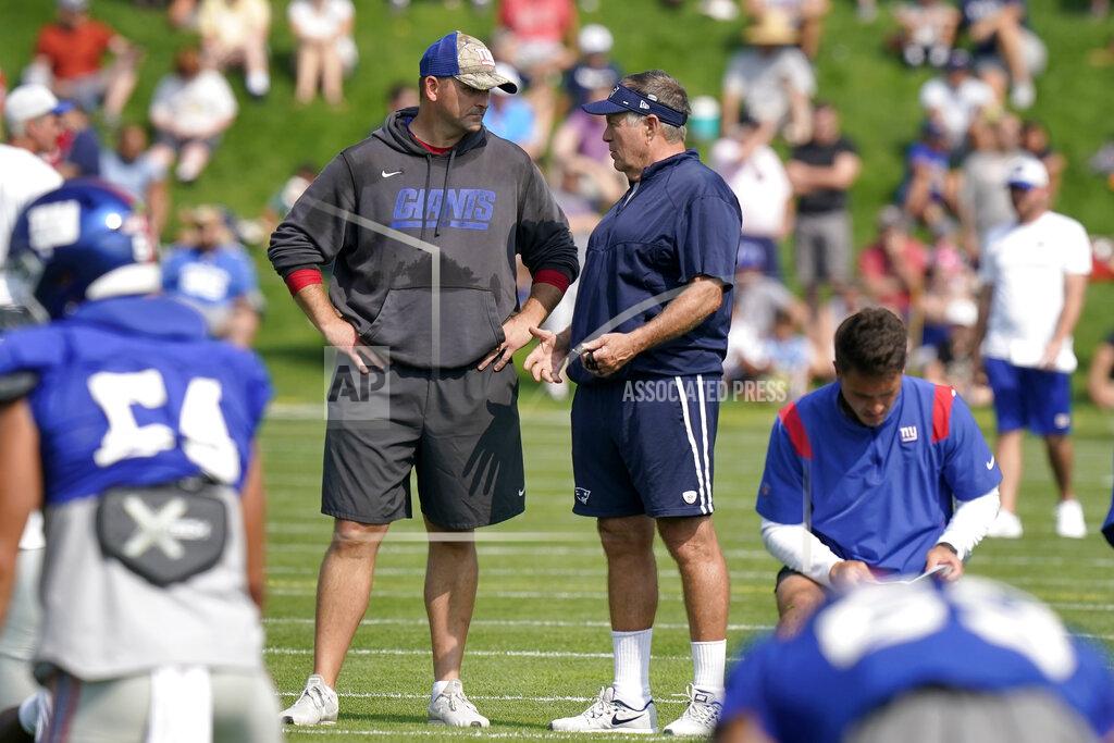Steven Senne New York Giants head coach Joe Judge, left, and New England Patriots head coach Bill Belichick, right, speak during a joint NFL football practice, Wednesday, Aug. 25, 2021, in Foxborough, Mass. (AP Photo/Steen Senne)
