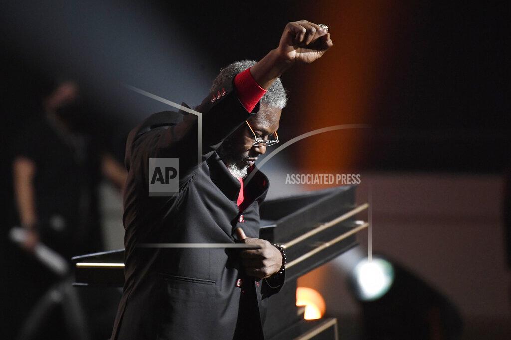 Jessica Hill Inductee Ben Wallace pumps his fist into the air during the 2021 Basketball Hall of Fame Enshrinement ceremony, Saturday, Sept. 11, 2021, in Springfield, Mass. (AP Photo/Jessica Hill)