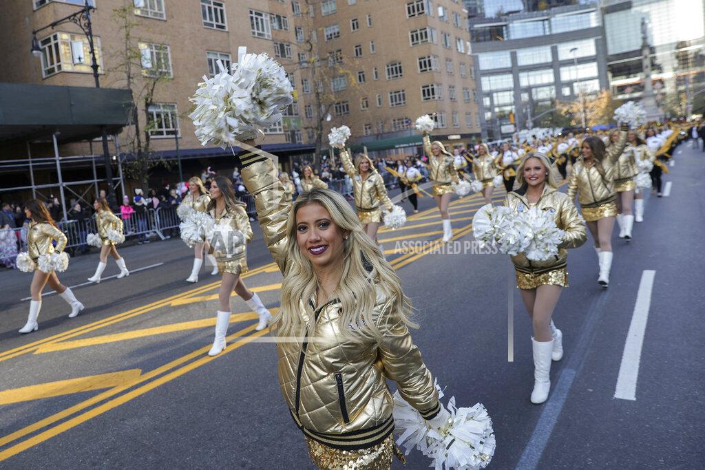 Jeenah Moon Cheerleaders from the University of Missouri marching band walk down Central Park South during the Macy's Thanksgiving Day Parade, Thursday, Nov. 24, 2022, in New York. (AP Photo/Jeenah Moon)