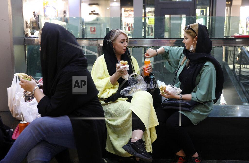 Vahid Salemi People have lunch in a shopping center at the Grand Bazaar in Tehran, Iran on Wednesday, June 10, 2020. As businesses re-open and people begin to move around more, health experts fear a growing complacency among Iran's 80 million people may further allow the virus to spread. (AP Photo/Vahid Salemi)
