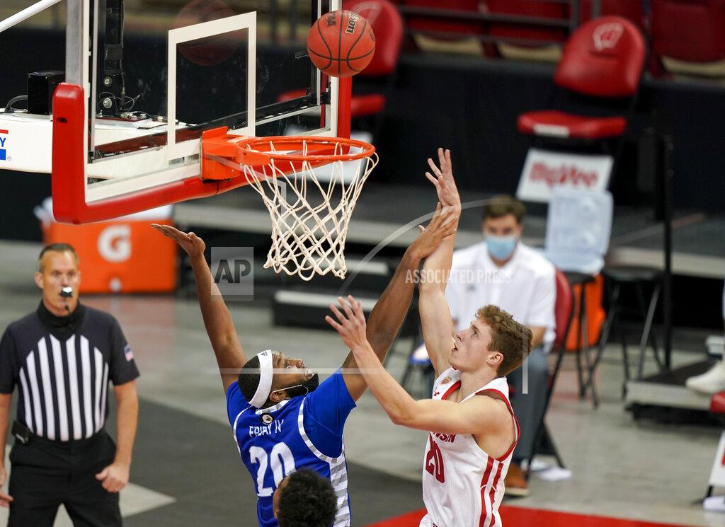 Andy Manis Wisconsin's Ben Carlson, right, shoots over Eastern Illinois' Sammy Friday (20) during the first half of an NCAA college basketball game Wednesday, Nov. 25, 2020, in Madison, Wis. (AP Photo/Andy Manis)
