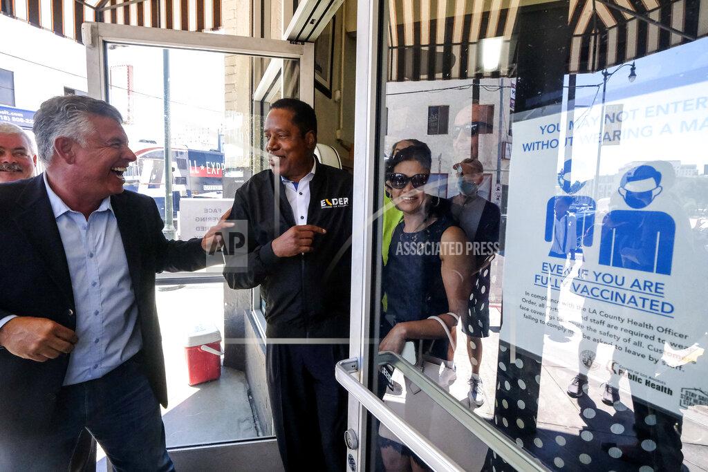 Ringo H.W. Chiu Republican conservative radio show host Larry Elder, second from left, and former Lt. Gov. Abel Maldonado, left, leave after they visiting Philippe The Original Deli during a campaign for the California gubernatorial recall election on Monday, Sept. 13, 2021, in Los Angeles. (AP Photo/Ringo H.W. Chiu)