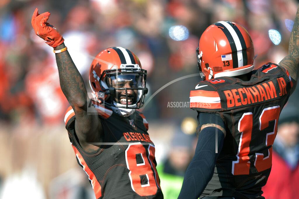 David Richard FILE - In this Sunday, Nov. 24, 2019 file photo, Cleveland Browns wide receiver Jarvis Landry (80) celebrates with Cleveland Browns wide receiver Odell Beckham Jr. (13) after Landry scored a 7-yard touchdown during the first half of an NFL football game against the Miami Dolphins in Cleveland. Every day on the practice field, Jarvis Landry looks around and expects to see Odell Beckham Jr. dancing during warmups or running pass routes alongside him. But his best friend and teammate isn't around _ and won't be until next year. (AP Photo/David Richard, File)