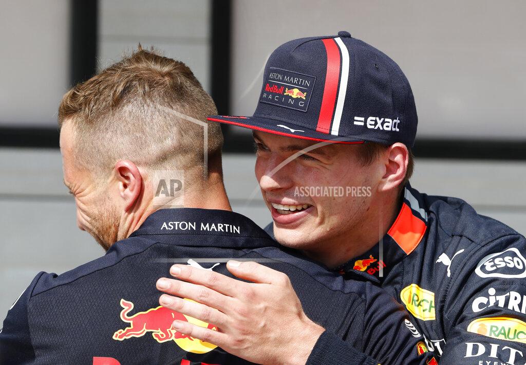 Laszlo Balogh Red Bull driver Max Verstappen of the Netherland's, right, celebrates with a member of his crew after qualification for the Hungarian Formula One Grand Prix at the Hungaroring racetrack in Mogyorod, northeast of Budapest, Hungary, Saturday, Aug. 3, 2019. Red Bull driver Max Verstappen of the Netherland's will take his first career pole position in the Hungarian Formula One Grand Prix on Sunday. (AP Photo/Laszlo Balogh)