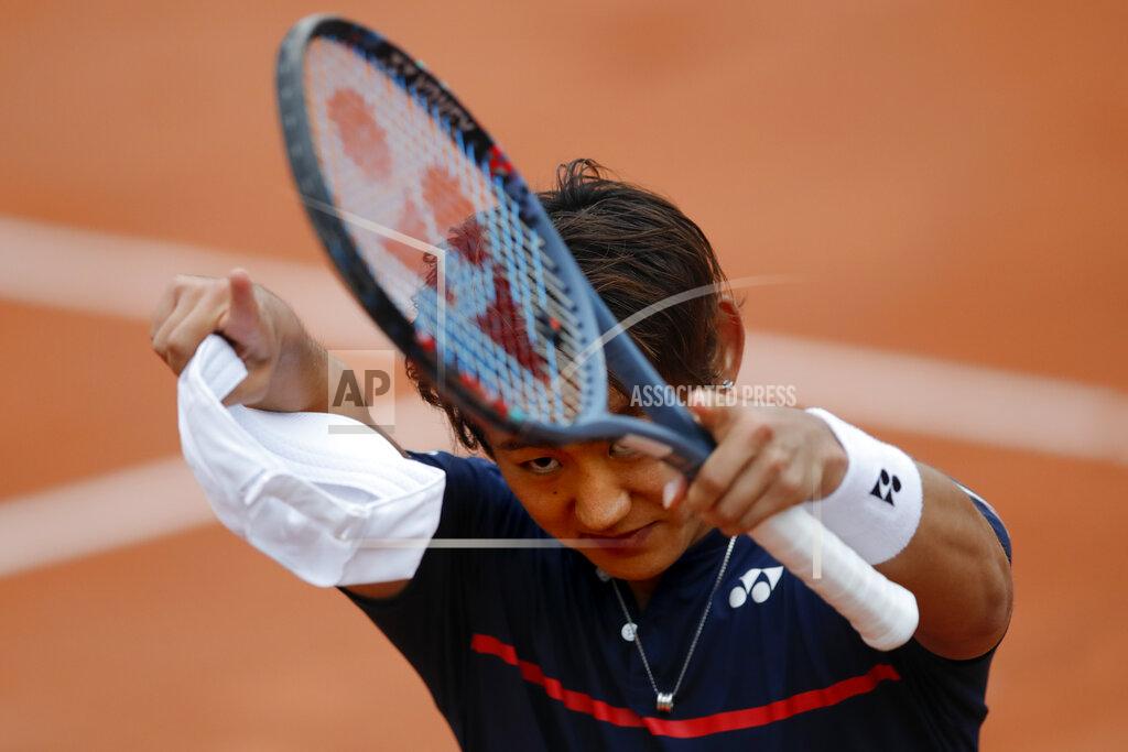 Christophe Ena Japan's Yoshihito Nishioka celebrates winning his first round match of the French Open tennis tournament against Canada's Felix Auger-Aliassime at the Roland Garros stadium in Paris, France, Monday, Sept. 28, 2020. (AP Photo/Christophe Ena)