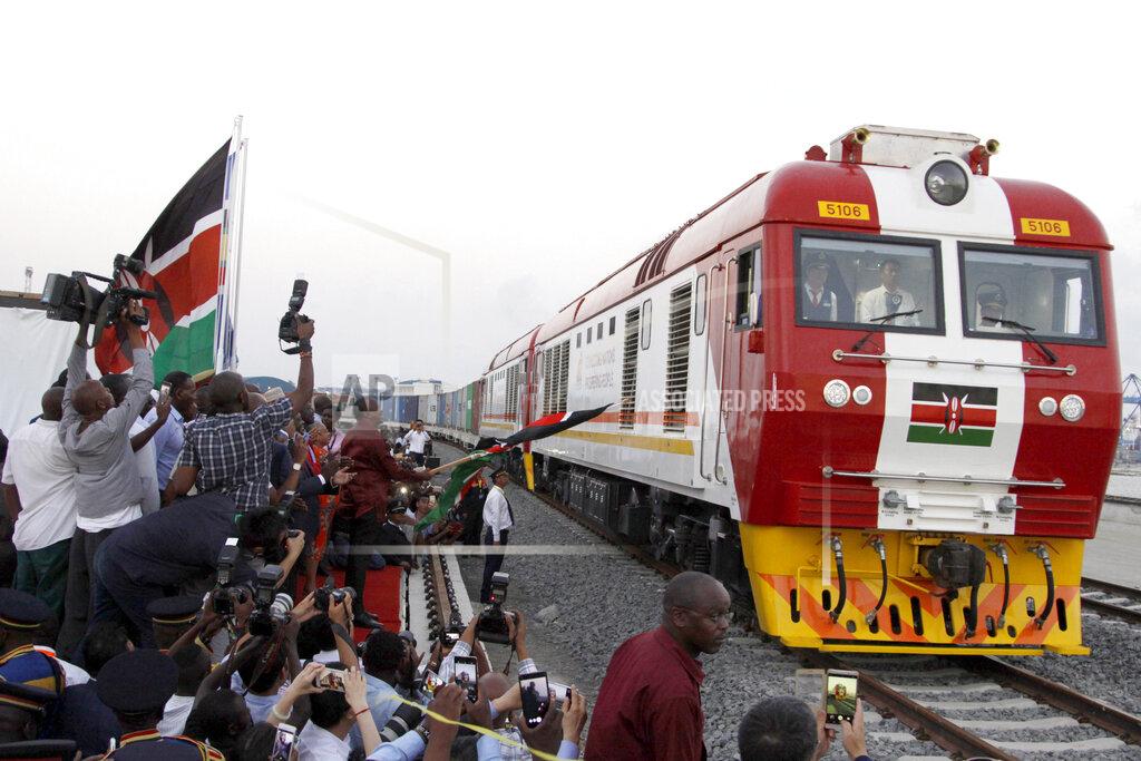 Khalil Senosi FILE - In this May 30, 2017, file photo, a Standard Gauge Railway cargo train rides from the port container depot on a Chinese-backed railway costing nearly $3.3 billion, opened by Kenya's president as one of the country's largest infrastructure projects since independence, in Mombasa, Kenya. African leaders in 2020 are asking what China can do for them as the coronavirus pandemic threatens to destroy economies across a continent where Beijing is both the top trading partner and top lender. (AP Photo/Khalil Senosi, File)