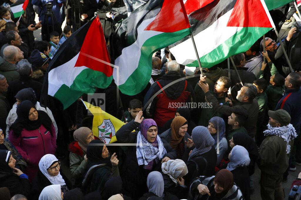 Bilal Hussein FILE - This Friday, Jan. 31, 2020 file photo, Palestinians chant slogans as they hold Palestinian flags, during a protest against the White House plan for ending the Israeli-Palestinian conflict, at Burj al-Barajneh refugee camp, south of Beirut, Lebanon. The financial crisis that the U.N. agency for Palestinian refugees is experiencing could lead to ceasing some of its activities in what would raise risks of instability in this volatile region, the head of the agency said Wednesday, Sept. 16. (AP Photo/Bilal Hussein, File)