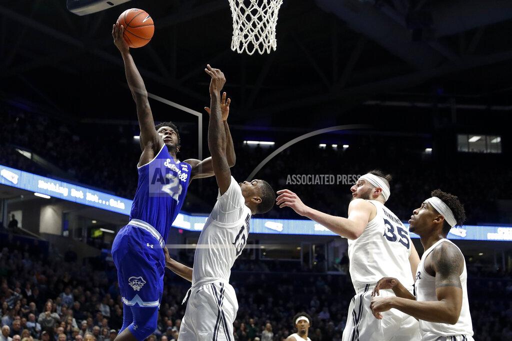 John Minchillo FILE - In this Jan. 2, 2019, file photo, Seton Hall's Ike Obiagu, left, shoots over Xavier's Naji Marshall (13) as Zach Hankins (35) and Paul Scruggs during the second half of an NCAA college basketball game in Cincinnati. The Pirates have a new rim presence on both ends of the court that could be a game changer. It starts with Florida State transfer Ike Obiagu. (AP Photo/John Minchillo, File)