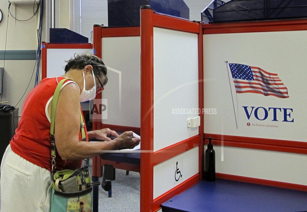 Lisa Rathke A voter marks her ballot in Vermont's statewide primary on Tuesday, Aug. 11, 2020, in Montpelier, Vt. (AP Photo/Lisa Rathke)