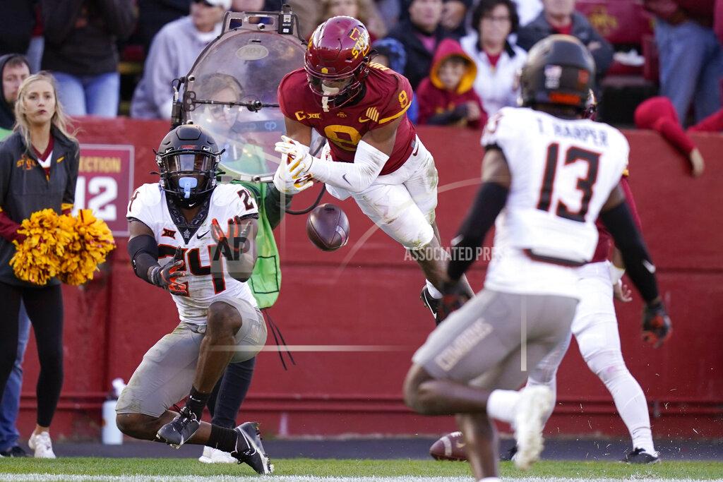 Charlie Neibergall Oklahoma State cornerback Jarrick Bernard-Converse (24) breaks up a pass intended for Iowa State wide receiver Xavier Hutchinson (8) during the second half of an NCAA college football game, Saturday, Oct. 23, 2021, in Ames, Iowa. Iowa State won 24-21. (AP Photo/Charlie Neibergall)