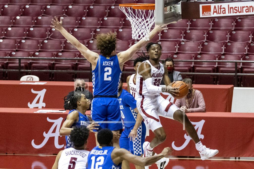 Vasha Hunt Alabama guard John Petty Jr. (23) works by Kentucky guard Devin Askew (2) for a shot during the second half of an NCAA college basketball game, Tuesday, Jan. 26, 2021, in Tuscaloosa, Ala. (AP Photo/Vasha Hunt)