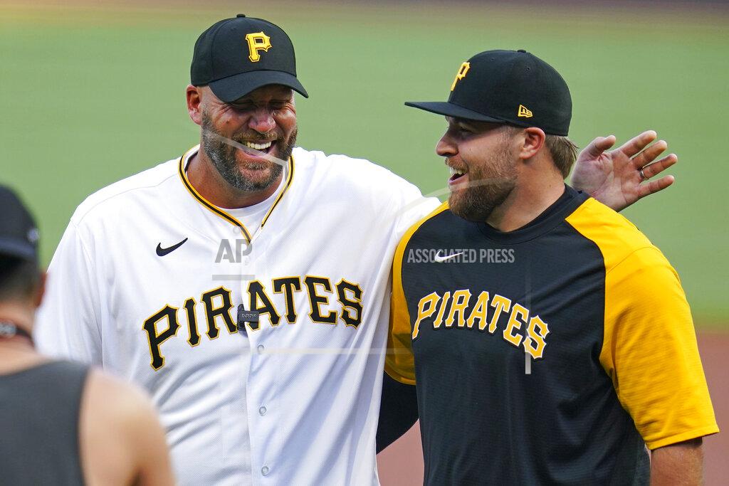 Gene J. Puskar Retired Pittsburgh Steelers quarterback Ben Roethlisberger, left, laughs with Pittsburgh Pirates relief pitcher David Bednar after throwing out a ceremonial first pitch before a baseball game between the Pirates and the Philadelphia Phillies in Pittsburgh, Friday, July 29, 2022. (AP Photo/Gene J. Puskar)