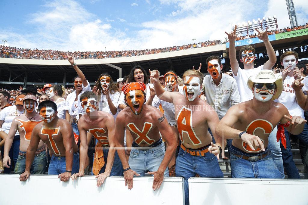 Cooper Neill Texas fans cheer for their team against Oklahoma in the second half of an NCAA college football game at the Cotton Bowl, Saturday, Oct. 6, 2018, in Dallas. (AP Photo/Cooper Neill)
