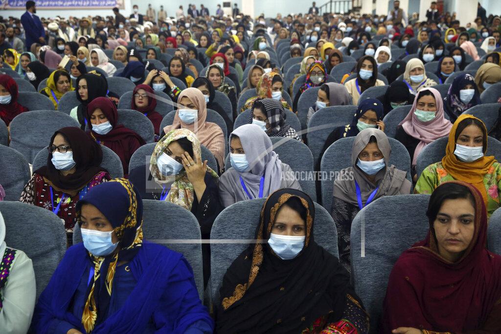 Rahmat Gul Delegates wearing a protective face masks to help curb the spread of the coronavirus attend an Afghan Loya Jirga meeting in Kabul, Afghanistan, Friday, Aug. 7, 2020. The traditional council opened Friday in the Afghan capital to decide the release of a final 400 Taliban - the last hurdle to the start of negotiations between Kabul’s political leadership and the Taliban in keeping with a peace deal the United States signed with the insurgent movement in February. (AP Photo/Rahmat Gul)