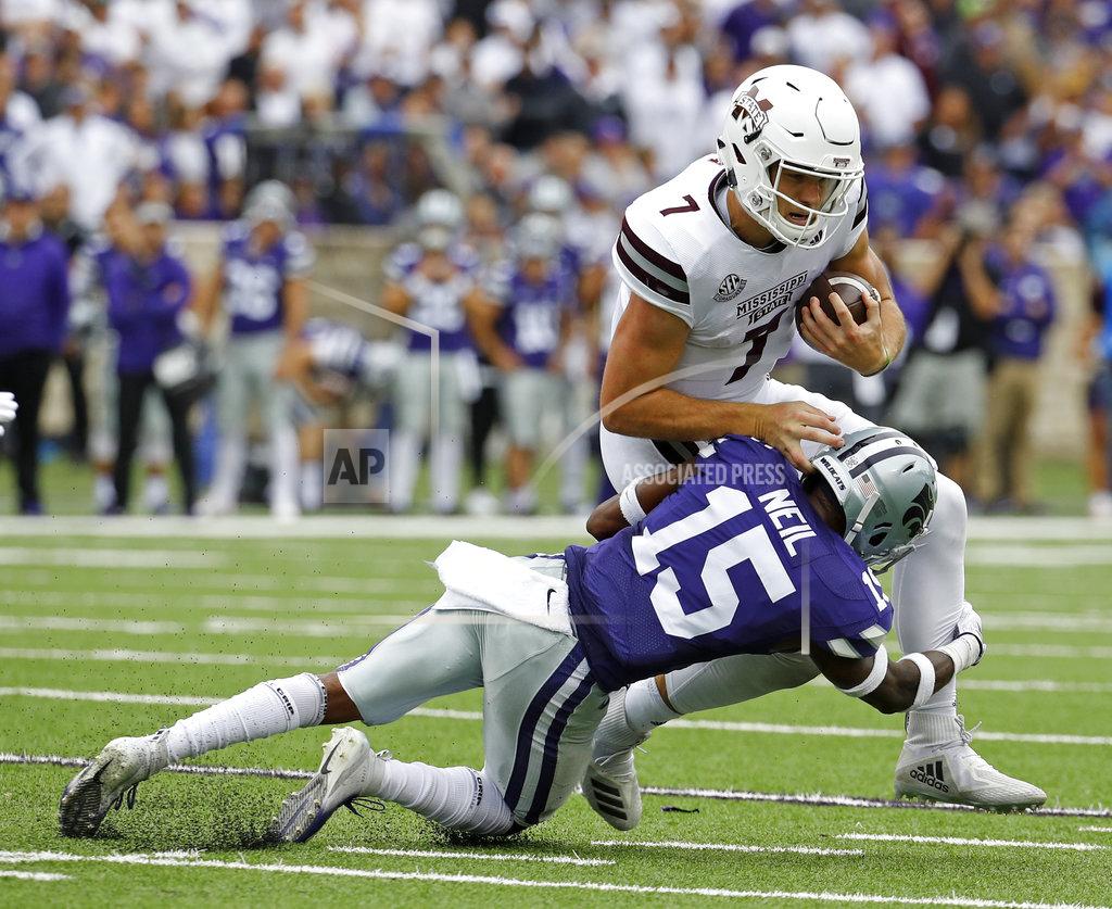 Charlie Riedel Mississippi State quarterback Nick Fitzgerald (7) is tackled by Kansas State defensive back Walter Neil Jr. (15) during the first half of an NCAA college football game Saturday, Sept. 8, 2018, in Manhattan, Kan. (AP Photo/Charlie Riedel)