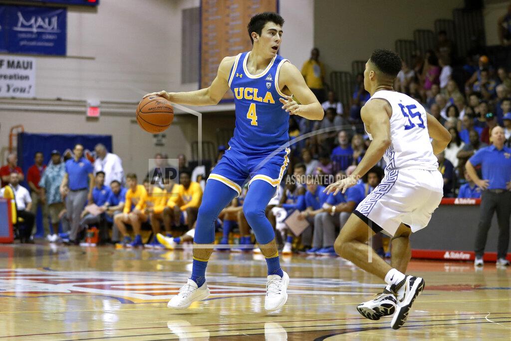 Marco Garcia UCLA guard Jaime Jaquez Jr. (4) tries to get around Chaminade guard Isaac Amaral-Artharee during the first half of an NCAA college basketball game Tuesday, Nov. 26, 2019, in Lahaina, Hawaii. (AP Photo/Marco Garcia)