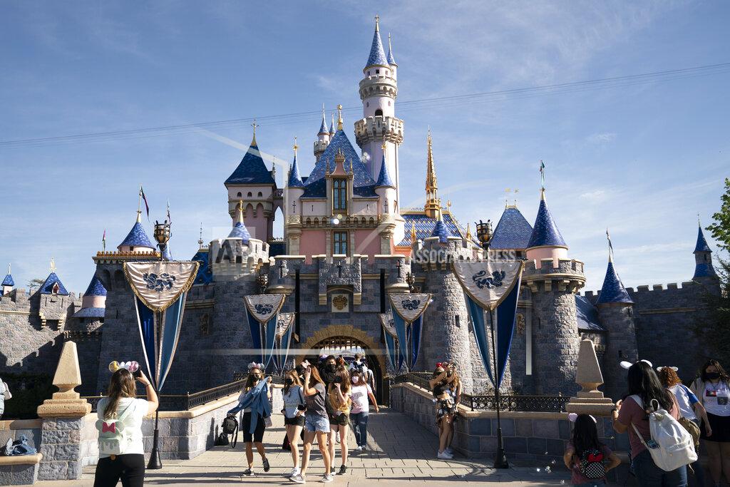 Jae C. Hong FILE - In this Friday, April 30, 2021, file photo, visitors exit The Sleeping Beauty Castle at Disneyland in Anaheim, Calif. California will offer six "dream vacation" incentives to spur more people to get coronavirus vaccinations, California Gov. Gavin Newsom said Monday, June 14, 2021, on the eve of the state's awarding of $15 million in cash prizes. Goodies in the package include floor seats at an NBA game with the LA Lakers, and tickets to Disneyland, Legoland, SeaWorld and a symphony, he said. (AP Photo/Jae C. Hong, File)